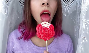 Egregious stepsister sucks a lollipop together with shows her long hot off colour tongue