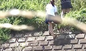 Japanese students peeing outdoors